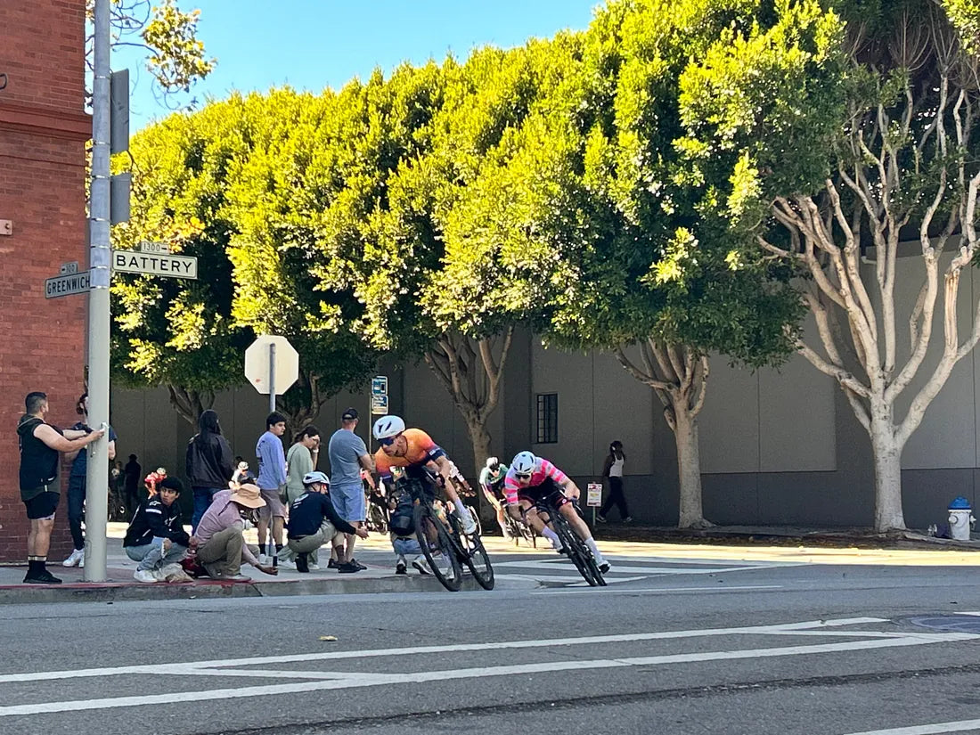Cyclists railing a corner during a criterium race in San Francisco